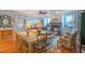Inviting living room with a fireplace, dining area, and natural light at 3325 Falls River Ave, Raleigh, NC 27614