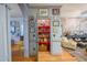 Charming pantry with red shelving, patterned wallpaper, and unique decor at 3325 Falls River Ave, Raleigh, NC 27614