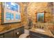 Quaint powder room featuring unique wallpaper, granite counters, and natural light at 3325 Falls River Ave, Raleigh, NC 27614