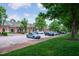 A retail area with storefronts, parking, and landscaped grounds, offering convenient shopping options for residents at 3325 Falls River Ave, Raleigh, NC 27614