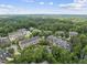 Scenic aerial view of the apartment complex surrounded by lush greenery and mature trees at 340 Allister Dr # 301, Raleigh, NC 27609