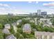 View of a community complex nestled among trees, with parking at 340 Allister Dr # 301, Raleigh, NC 27609
