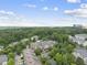 Aerial view of a community of apartments next to a lush green forest at 340 Allister Dr # 301, Raleigh, NC 27609