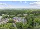 Aerial view of a community complex nestled among trees with parking at 340 Allister Dr # 301, Raleigh, NC 27609