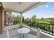 Relaxing outdoor balcony with a table and chairs, offering serene views of the surrounding greenery at 340 Allister Dr # 301, Raleigh, NC 27609