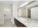 Bathroom features a double sink vanity and a large mirror, plus a glass-enclosed shower at 340 Allister Dr # 301, Raleigh, NC 27609
