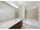 Bathroom with large mirror, vanity with dark wood cabinets, and shower-tub combination at 340 Allister Dr # 301, Raleigh, NC 27609