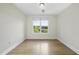 Bright bedroom with hardwood floors and large window overlooking neighborhood at 340 Allister Dr # 301, Raleigh, NC 27609