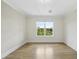 Bright bedroom with hardwood floors and a large window allowing for ample natural light at 340 Allister Dr # 301, Raleigh, NC 27609