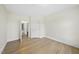 Bedroom with hardwood floors, closet, and doorway leading to another room at 340 Allister Dr # 301, Raleigh, NC 27609