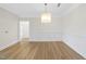 Large dining room with beautiful hardwood floors, decorative chandelier and wainscoting at 340 Allister Dr # 301, Raleigh, NC 27609
