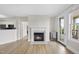 Open living room with fireplace and mini-bar, plus access to the outdoor balcony at 340 Allister Dr # 301, Raleigh, NC 27609