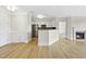 Inviting living room with a cozy fireplace and adjacent kitchen, great for Gathering gatherings at 340 Allister Dr # 301, Raleigh, NC 27609