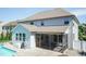 Spacious screened-in porch, swimming pool, and patio with patio furniture in the backyard at 3536 Greenville Loop Rd, Wake Forest, NC 27587