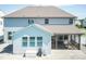 Aerial view of the backyard with screened-in porch, light-blue siding, swimming pool, and patio at 3536 Greenville Loop Rd, Wake Forest, NC 27587