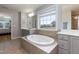 Bright bathroom with soaking tub, dual vanities, and abundant natural light at 3536 Greenville Loop Rd, Wake Forest, NC 27587