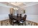 Dining room featuring wood floors, a chandelier, and wainscoting at 3536 Greenville Loop Rd, Wake Forest, NC 27587