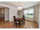 Dining room with wood floors, a chandelier, and natural light from the windows at 3536 Greenville Loop Rd, Wake Forest, NC 27587