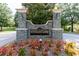 Stonegate community entrance with elegant stone signage and colorful landscaping at 3536 Greenville Loop Rd, Wake Forest, NC 27587