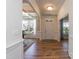 Inviting foyer showcasing hardwood floors, coffered ceilings, and ample natural light, with views into other living spaces at 3536 Greenville Loop Rd, Wake Forest, NC 27587