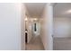 Bright hallway leads to bedrooms and bathrooms with neutral carpet and white walls at 3536 Greenville Loop Rd, Wake Forest, NC 27587