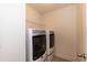 Functional laundry room features modern, front-load washer and dryer at 3536 Greenville Loop Rd, Wake Forest, NC 27587