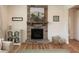 Living room featuring a stone fireplace, hardwood floors, and a comfortable seating area at 3536 Greenville Loop Rd, Wake Forest, NC 27587