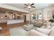 Open concept living room connected to the kitchen features a fireplace, neutral décor and hardwood floors at 3536 Greenville Loop Rd, Wake Forest, NC 27587