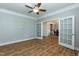Living room with hardwood floors, ceiling fan, and french doors at 3536 Greenville Loop Rd, Wake Forest, NC 27587