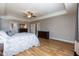 Spacious bedroom with beautiful wood floors, tray ceilings, and ample natural light at 3536 Greenville Loop Rd, Wake Forest, NC 27587