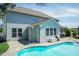 View of the in-ground pool, light-blue siding, concrete patio, and a lush green yard at 3536 Greenville Loop Rd, Wake Forest, NC 27587