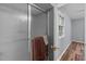 Bathroom features a shower with glass door and the doorway to an adjacent bedroom at 4119 Toroella St, Durham, NC 27704