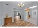 Open dining area flowing into kitchen and living spaces, hardwood floors and neutral walls at 4119 Toroella St, Durham, NC 27704