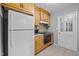 Cozy kitchen featuring modern appliances, wood cabinetry, and a functional layout at 4119 Toroella St, Durham, NC 27704