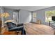 Inviting living room featuring hardwood floors, neutral walls, and a classic interior door at 4119 Toroella St, Durham, NC 27704