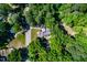 Overhead view of home on a lot surrounded by mature trees at 4220 Hope Valley Road Rd, Durham, NC 27707