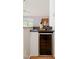 Compact bar area featuring a wine cooler and stylish countertop at 4220 Hope Valley Road Rd, Durham, NC 27707