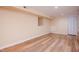 Clean, unfinished basement area with laminate flooring and bright lighting offers a versatile space at 4220 Hope Valley Road Rd, Durham, NC 27707