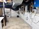 Unfinished basement with white walls provides space for storage or potential finishing at 4220 Hope Valley Road Rd, Durham, NC 27707