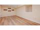 Spacious basement area with light wood floors, neutral walls, and ample lighting offers a versatile living space at 4220 Hope Valley Road Rd, Durham, NC 27707