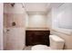 Tiled bathroom showcases updated fixtures, a dark vanity, and a shower with modern design at 4220 Hope Valley Road Rd, Durham, NC 27707