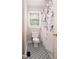 Cozy bathroom featuring patterned tile floor, and a window for natural light at 4220 Hope Valley Road Rd, Durham, NC 27707