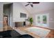 Bright bedroom with vaulted ceiling, stylish rug, french doors to deck, modern furnishings, and a TV at 4220 Hope Valley Road Rd, Durham, NC 27707