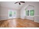Bright bedroom featuring high ceilings, a ceiling fan, and double doors at 4220 Hope Valley Road Rd, Durham, NC 27707