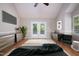 Bright bedroom featuring a vaulted ceiling, hardwood floors, and French doors leading to the backyard at 4220 Hope Valley Road Rd, Durham, NC 27707