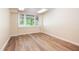 Bright room features natural light and laminate flooring, with ample space and electrical outlets at 4220 Hope Valley Road Rd, Durham, NC 27707