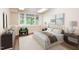 Cozy bedroom with neutral decor, large window, and stylish furnishings offers a tranquil retreat at 4220 Hope Valley Road Rd, Durham, NC 27707