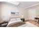 Staged bedroom featuring a comfortable bed, nightstands, lamps and artwork for relaxing ambiance at 4220 Hope Valley Road Rd, Durham, NC 27707