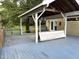 Outdoor deck features a covered shelter, entrance to the home, and outdoor seating at 4220 Hope Valley Road Rd, Durham, NC 27707
