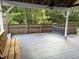 The deck is shaded with lattice and a bench offers a relaxing spot with a natural view at 4220 Hope Valley Road Rd, Durham, NC 27707